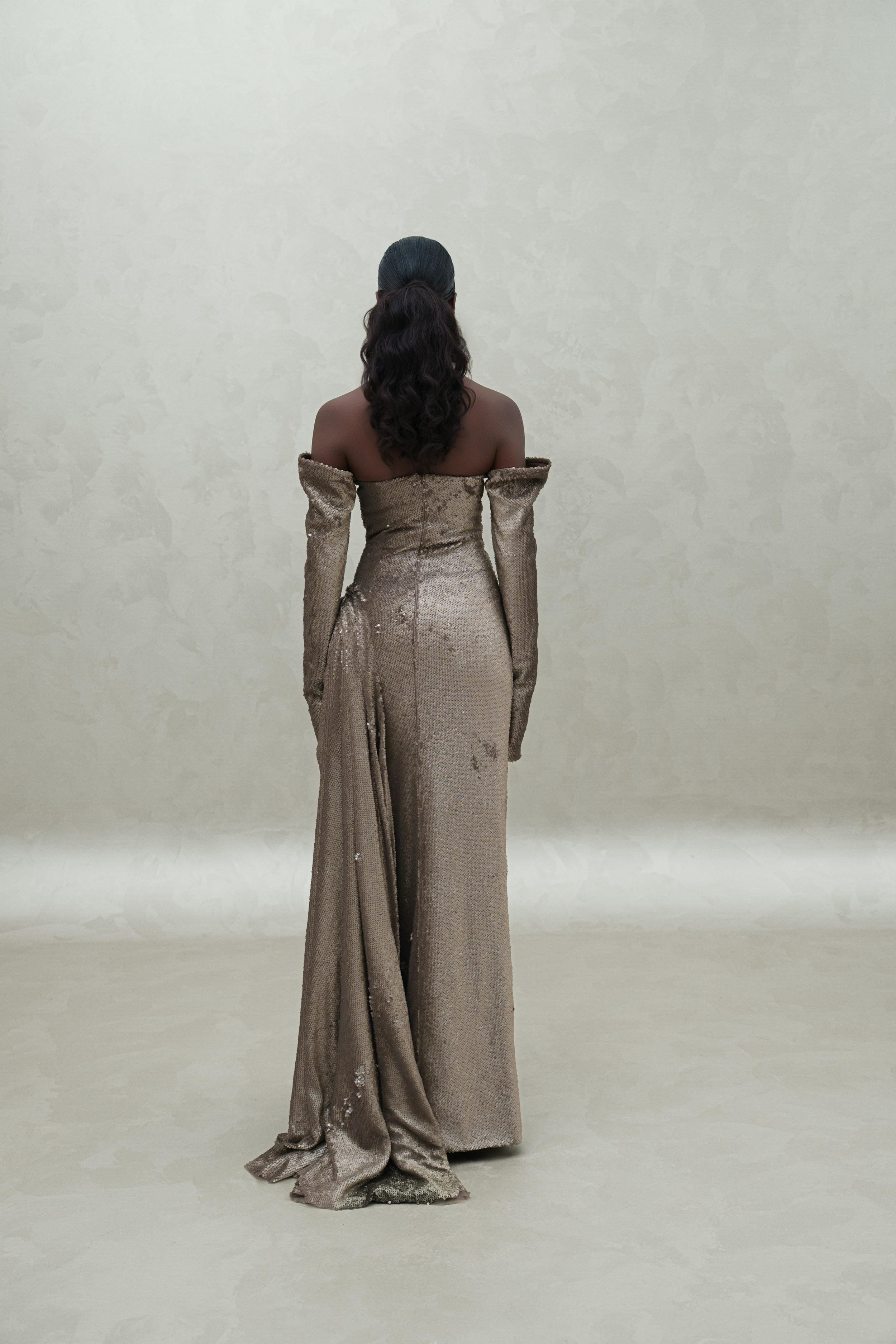 sequined dress with sewed gloves